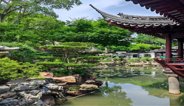 A pond with trees and a building with a roof
AI-generated content may be incorrect.